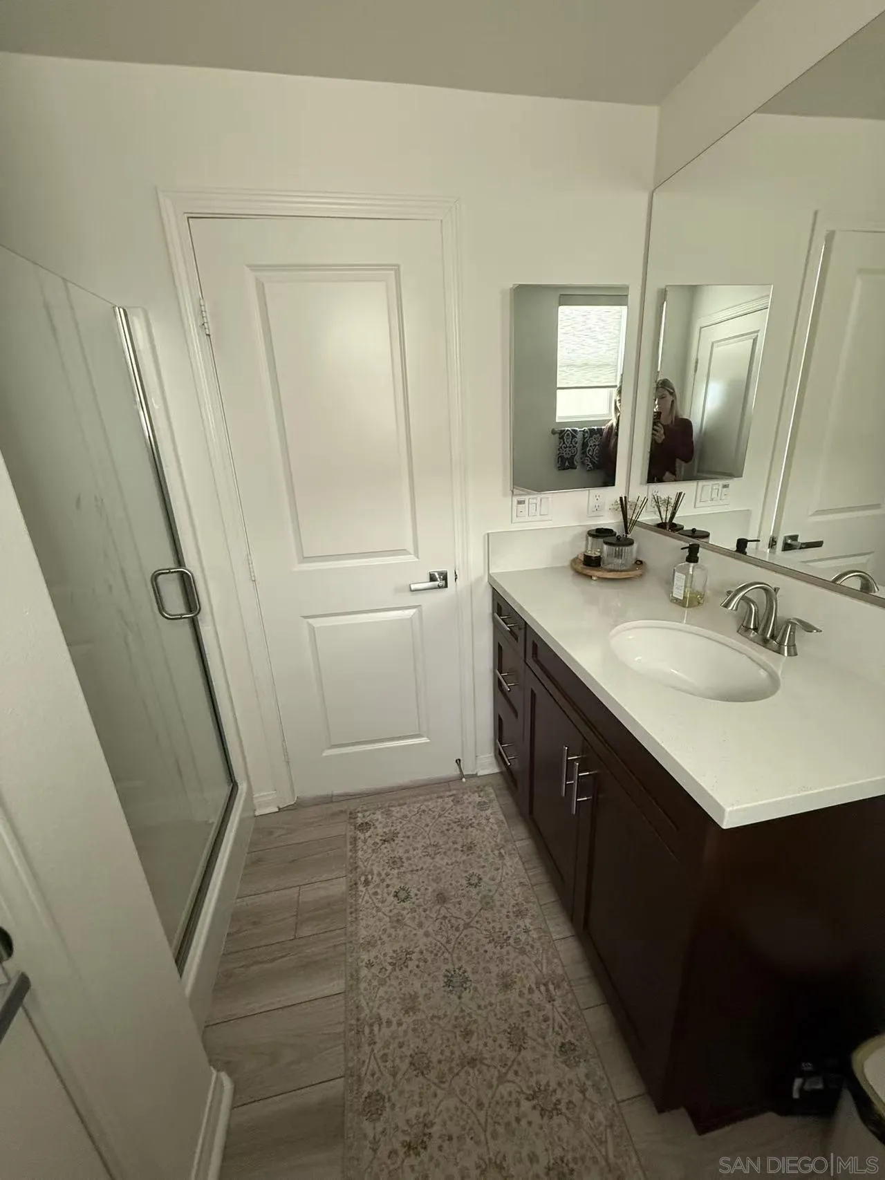8515 Goldfield Street Santee, CA 92071 - Photo 23 of 34 a spacious bathroom with a double vanity sink a and mirror