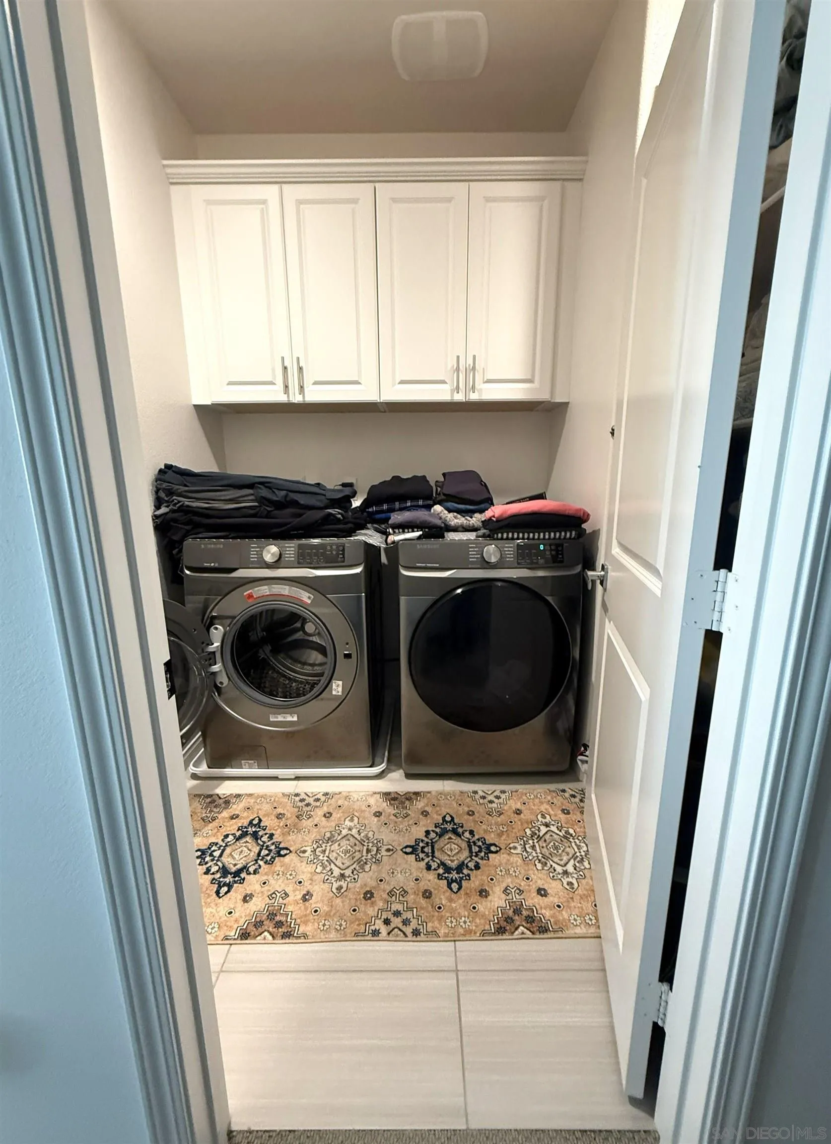 8515 Goldfield Street Santee, CA 92071 - Photo 25 of 34 a utility room with wooden floor washer and dryer