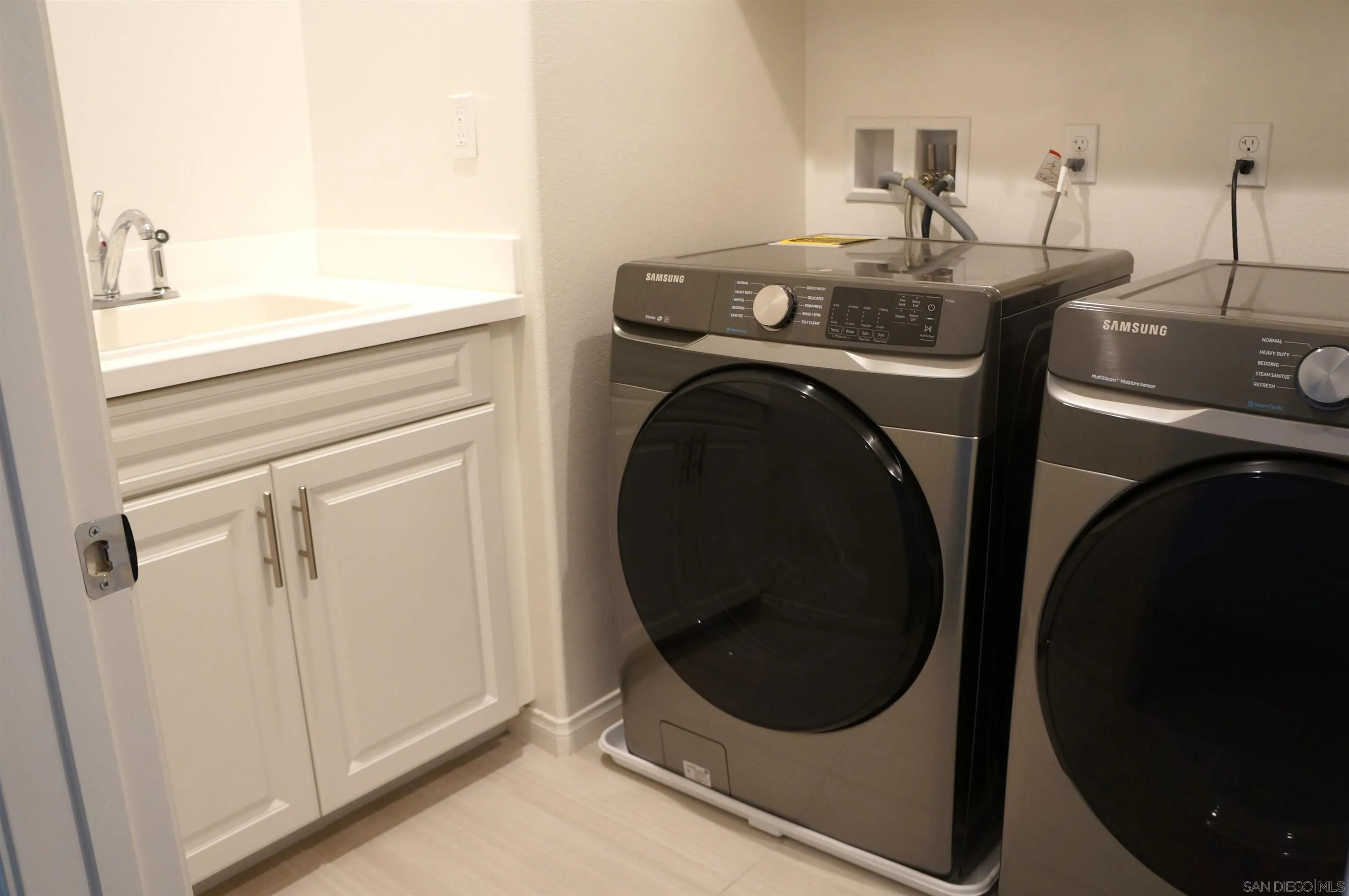 8515 Goldfield Street Santee, CA 92071 - Photo 26 of 34 a utility room with dryer and washer
