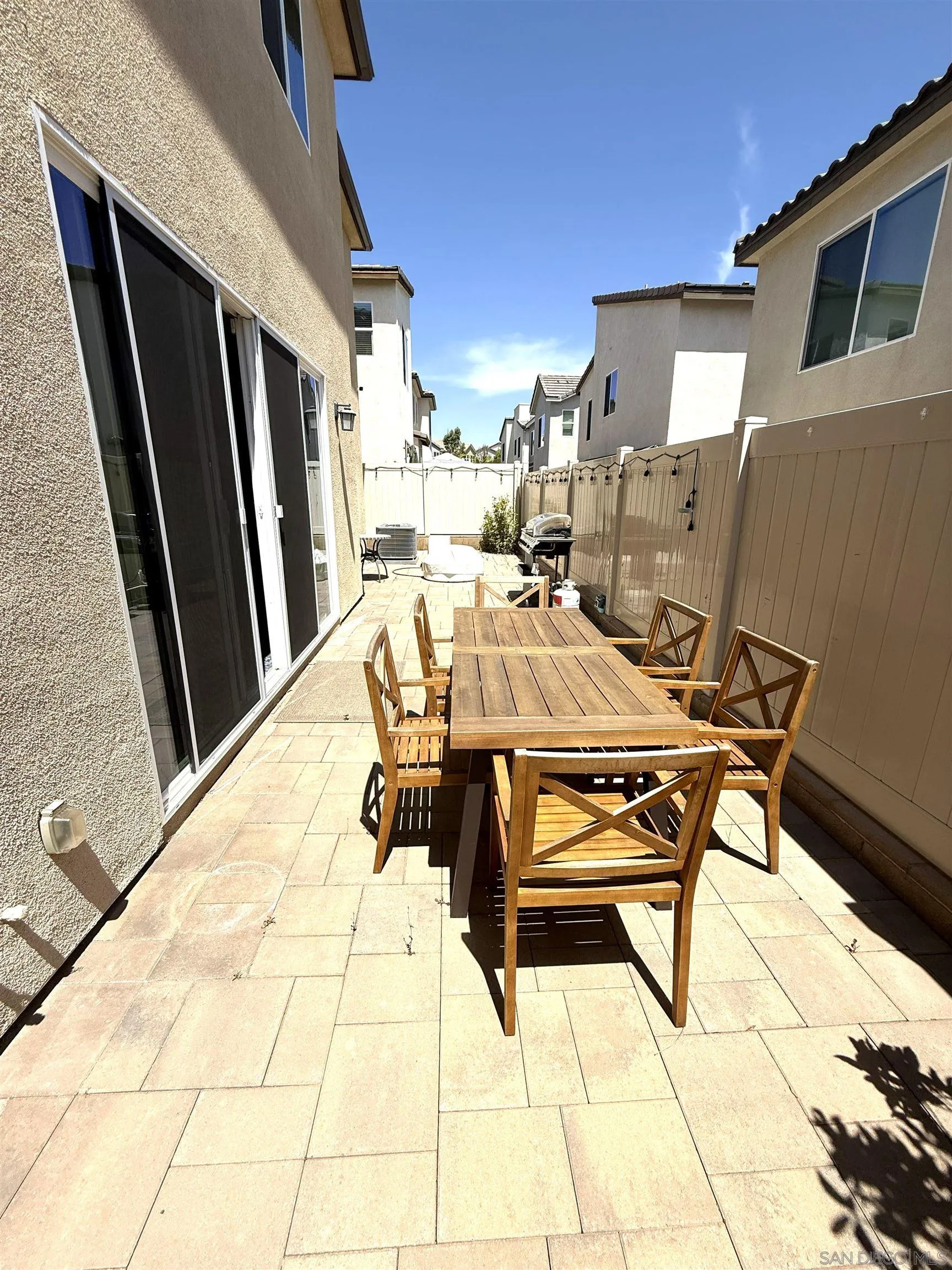 8515 Goldfield Street Santee, CA 92071 - Photo 30 of 34 a view of a patio with a table and chairs