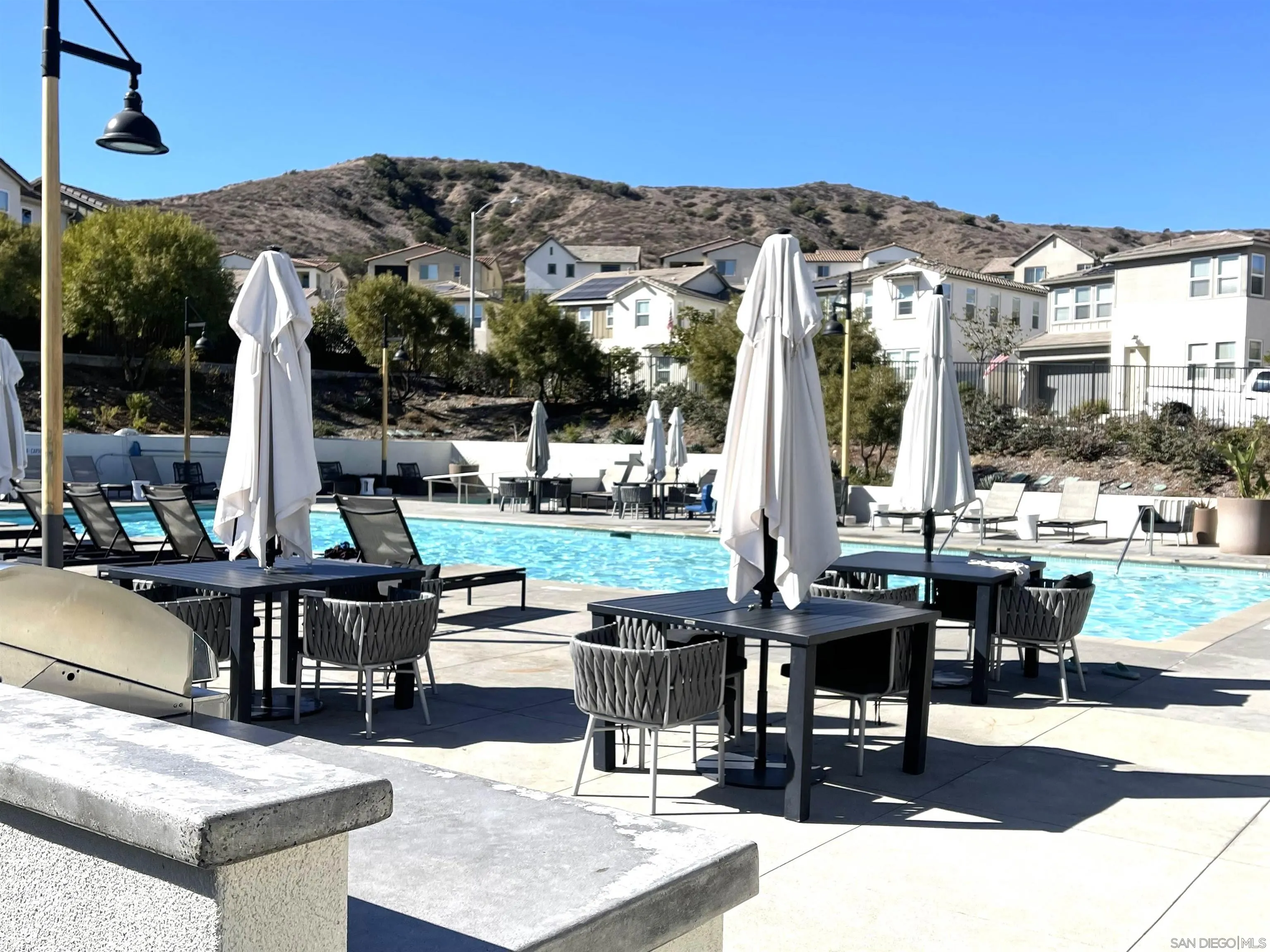 8515 Goldfield Street Santee, CA 92071 - Photo 31 of 34 a view of a patio with chairs and tables