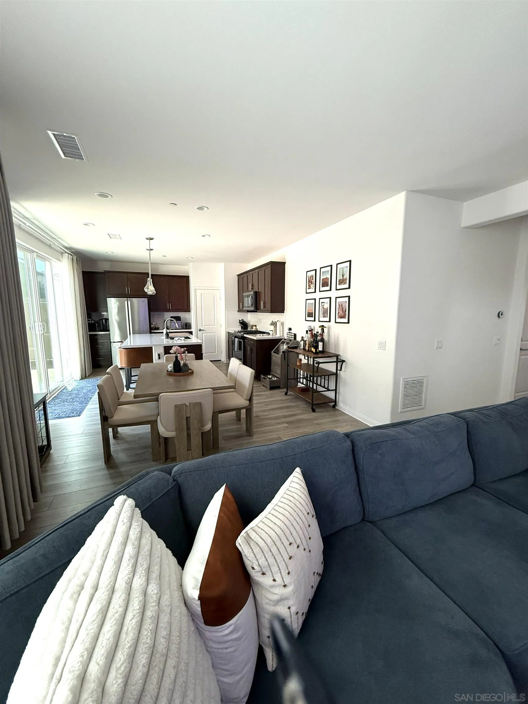 8515 Goldfield Street Santee, CA 92071 - Photo 5 of 34 a living room with furniture wooden floor and a flat screen tv