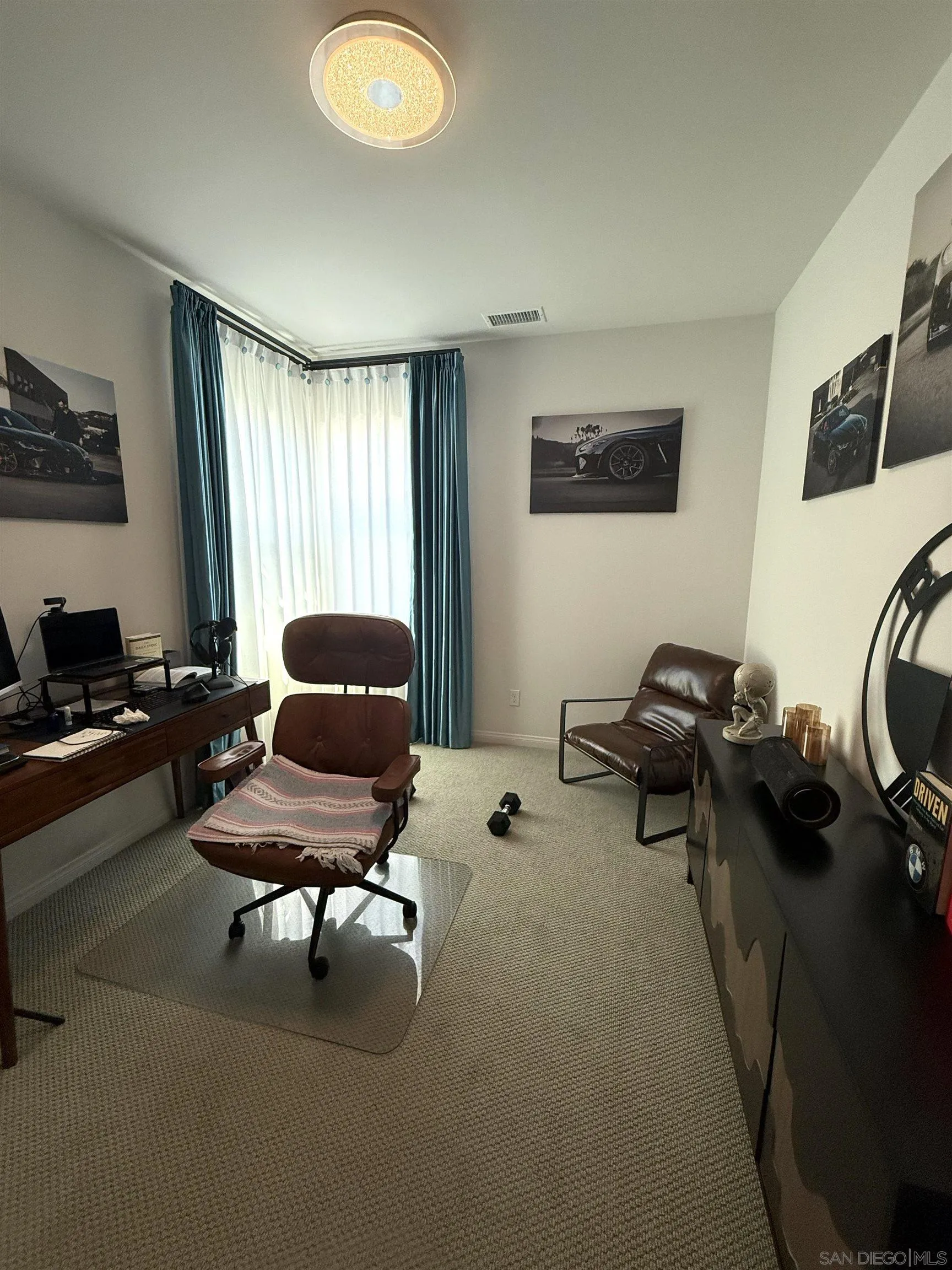 8515 Goldfield Street Santee, CA 92071 - Photo 8 of 34 a living room with furniture and a window