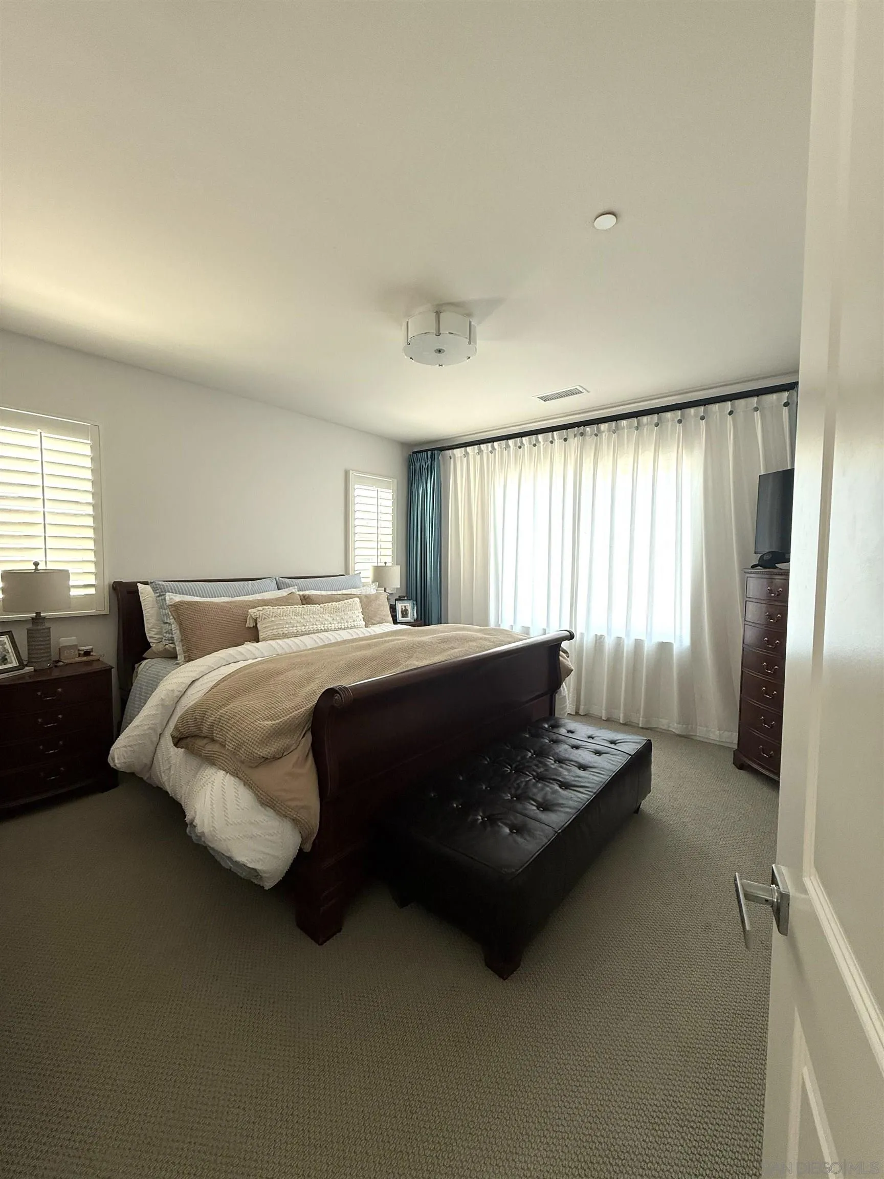 8515 Goldfield Street Santee, CA 92071 - Photo 10 of 34 a bedroom with a bed and a window