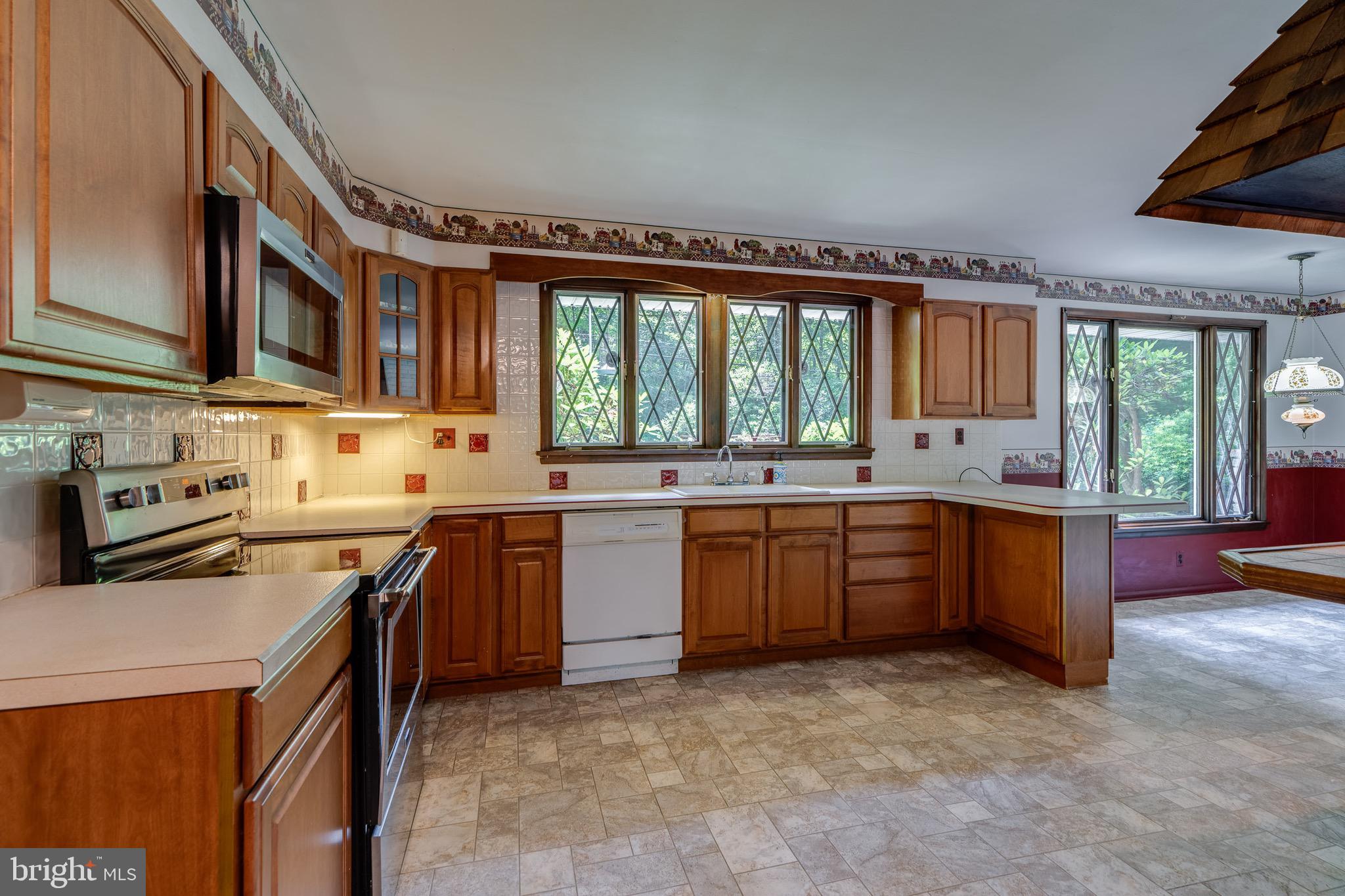1111 Pennsy Road Pequea, PA 17565 - Photo 15 of 44 a kitchen with a sink stove and cabinets