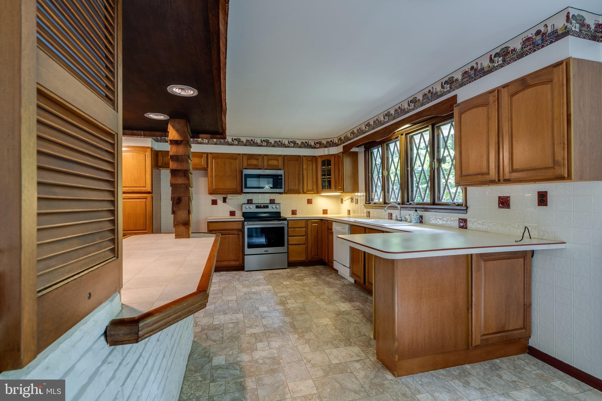 1111 Pennsy Road Pequea, PA 17565 - Photo 17 of 44 a kitchen with sink cabinets and window