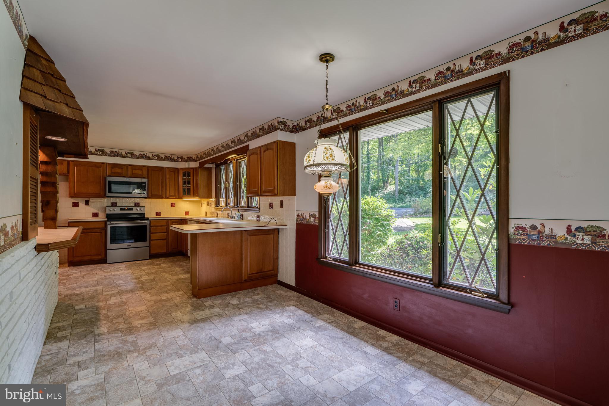 1111 Pennsy Road Pequea, PA 17565 - Photo 18 of 44 a large kitchen with kitchen island granite countertop a large window