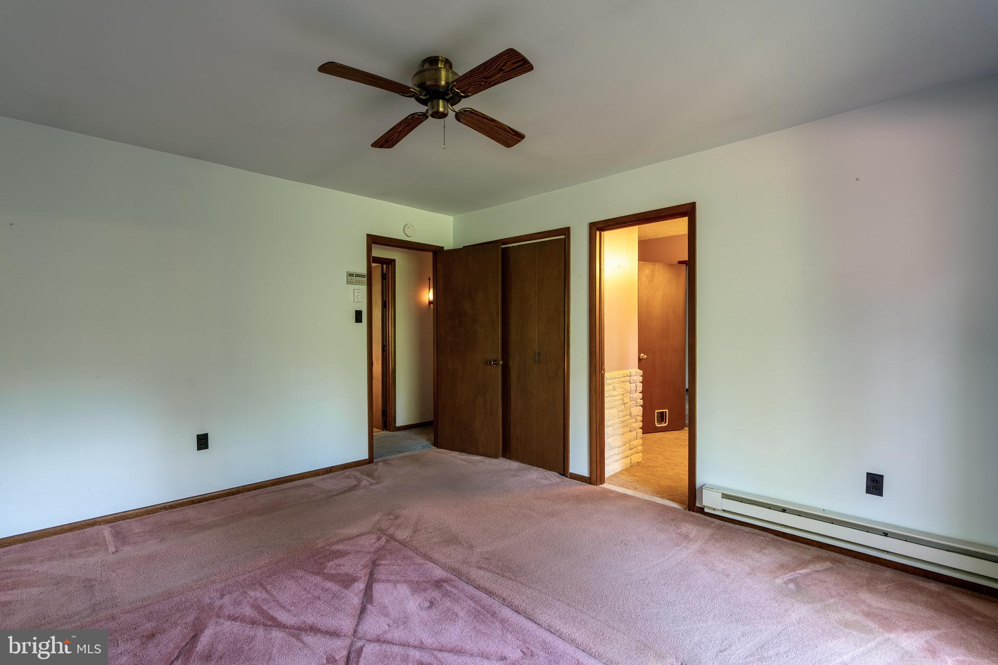 1111 Pennsy Road Pequea, PA 17565 - Photo 23 of 44 an empty room with a ceiling fan and a window