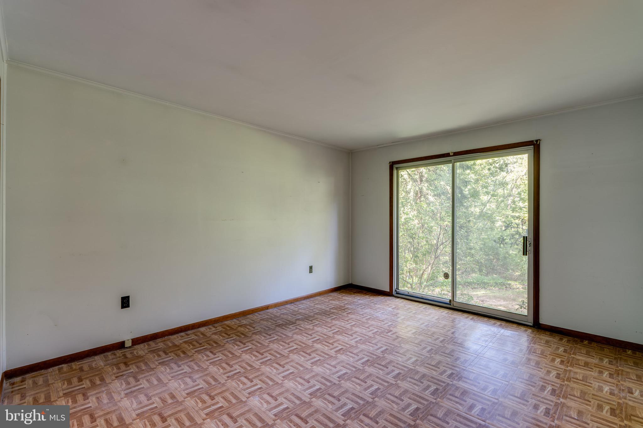 1111 Pennsy Road Pequea, PA 17565 - Photo 27 of 44 a view of an empty room with wooden floor and a window
