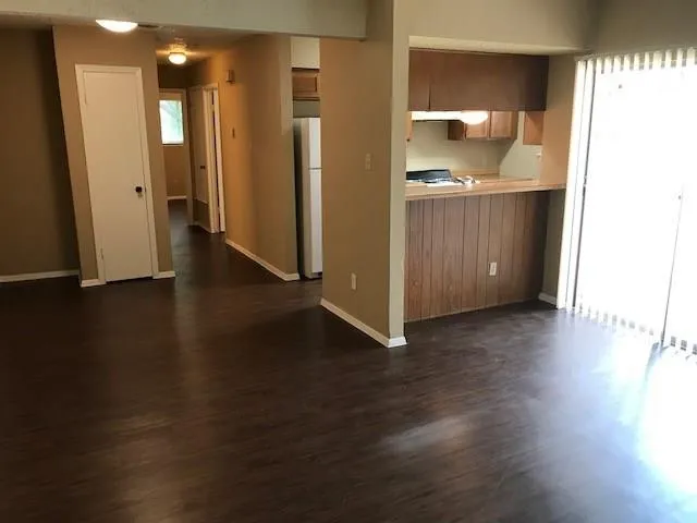 a view of a kitchen cabinets and wooden floor