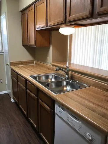 a kitchen with a sink and a window