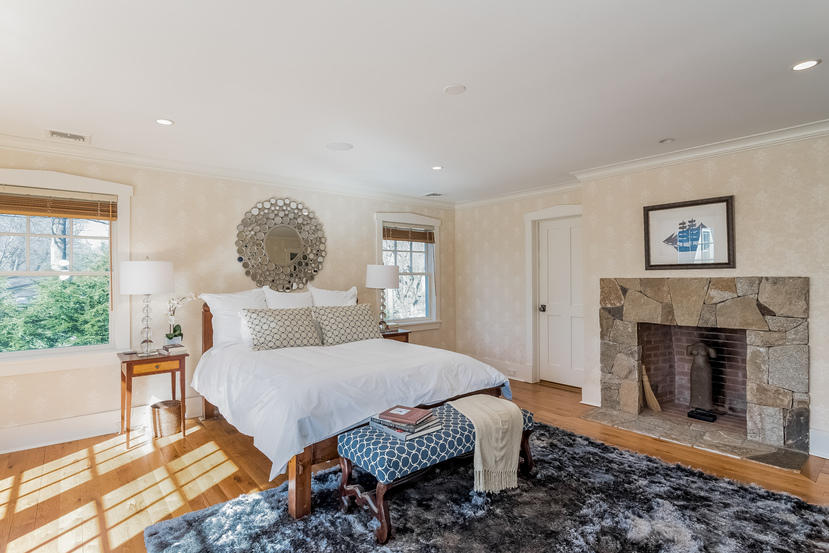 7 Ledge Road Rowayton, CT 06853 - Photo 11 of 30 a bedroom with a bed and a fireplace