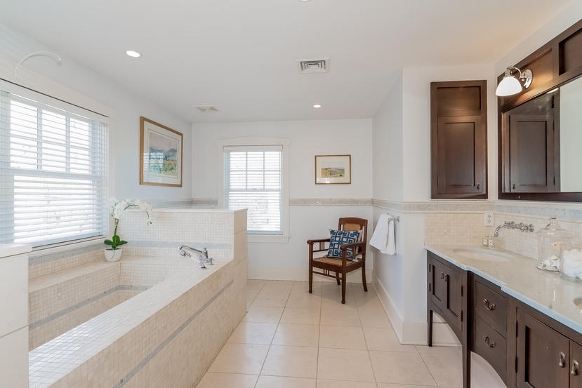 7 Ledge Road Rowayton, CT 06853 - Photo 13 of 30 a spacious bathroom with a granite countertop tub sink and mirror