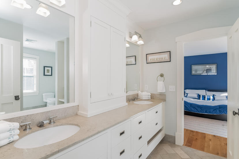 7 Ledge Road Rowayton, CT 06853 - Photo 16 of 30 a bathroom with double vanity sinks a vanity two mirror and shower