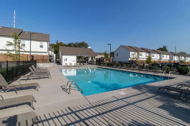a view of a swimming pool with a patio