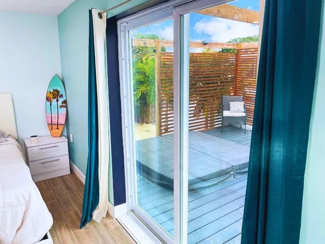 a view of an entryway with a floor to ceiling window