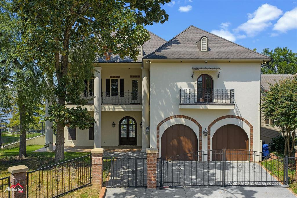 1 Lake Point Place Shreveport, LA 71119 - Photo 1 of 38 a front view of a house with garden