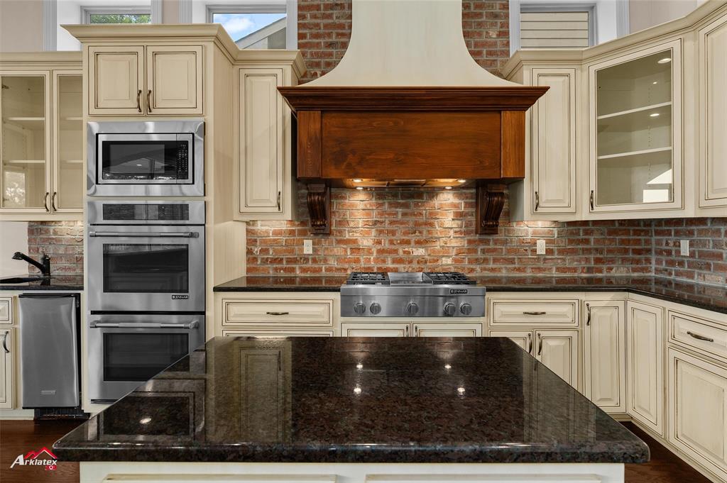 1 Lake Point Place Shreveport, LA 71119 - Photo 13 of 38 a kitchen with stainless steel appliances a stove a microwave and a sink