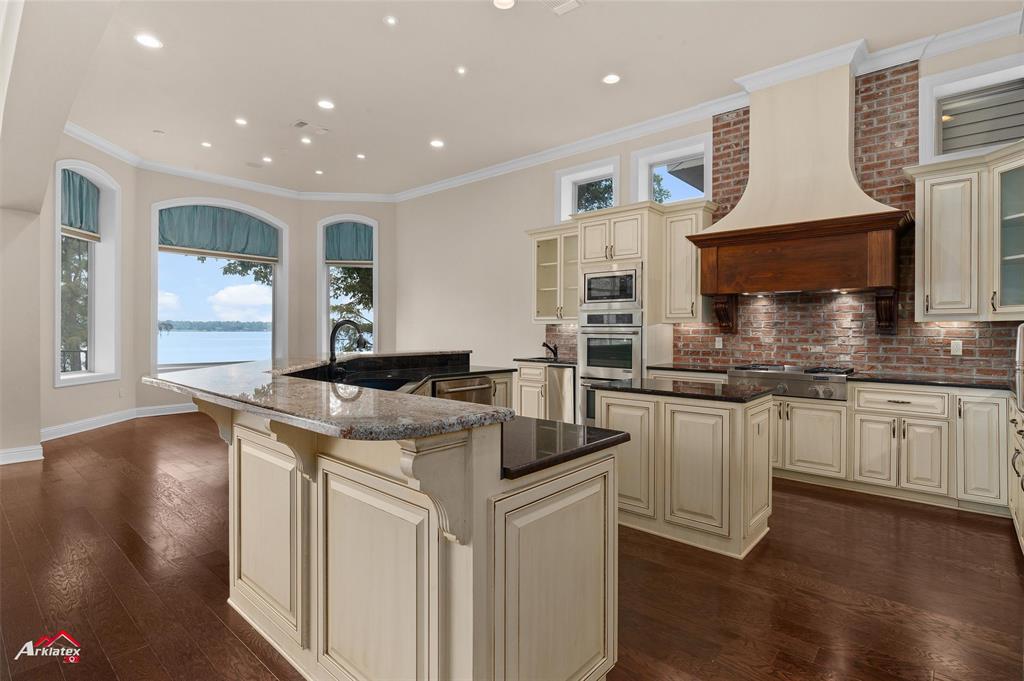 1 Lake Point Place Shreveport, LA 71119 - Photo 15 of 38 a kitchen with stainless steel appliances granite countertop a sink and a stove