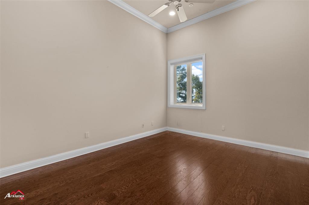 1 Lake Point Place Shreveport, LA 71119 - Photo 20 of 38 an empty room with wooden floor and windows