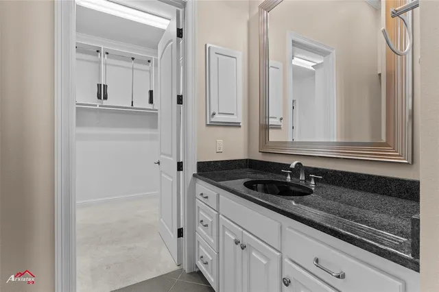 a bathroom with a glass shower door