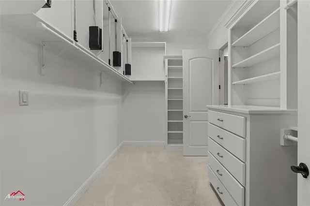 a bathroom with a granite countertop sink and a window