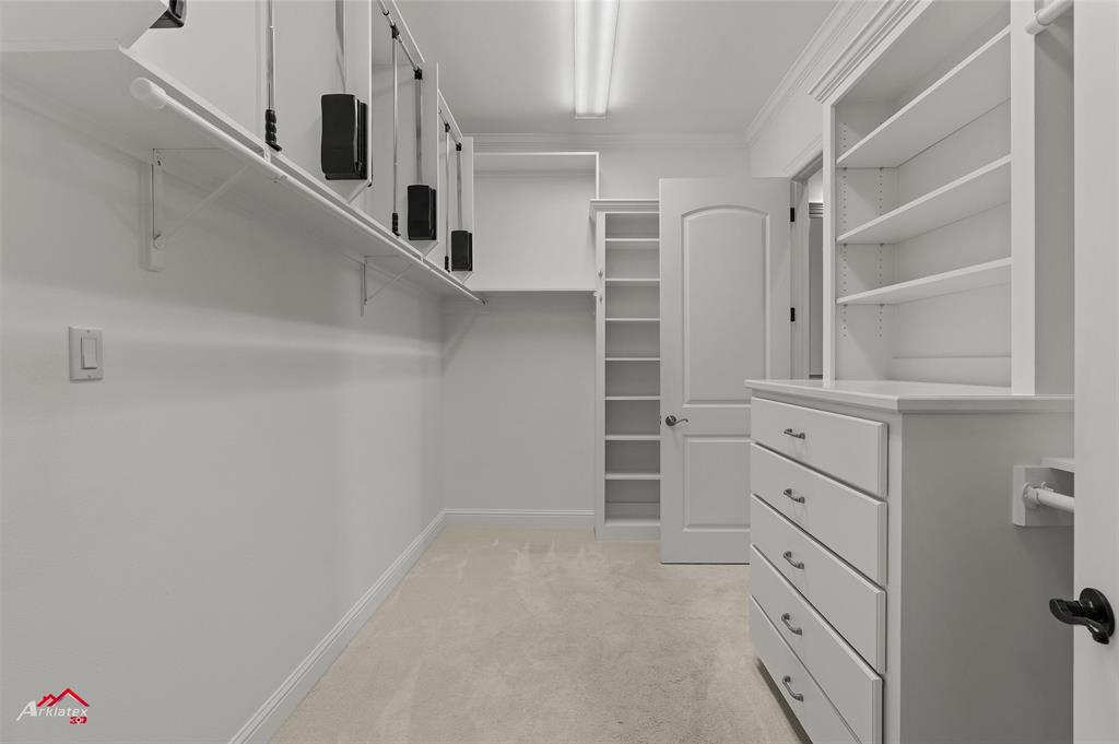 1 Lake Point Place Shreveport, LA 71119 - Photo 25 of 38 a view of walk in closet with empty racks