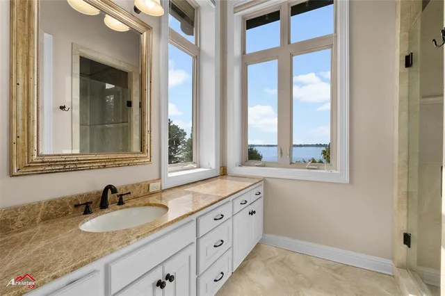 an empty room with closet and windows