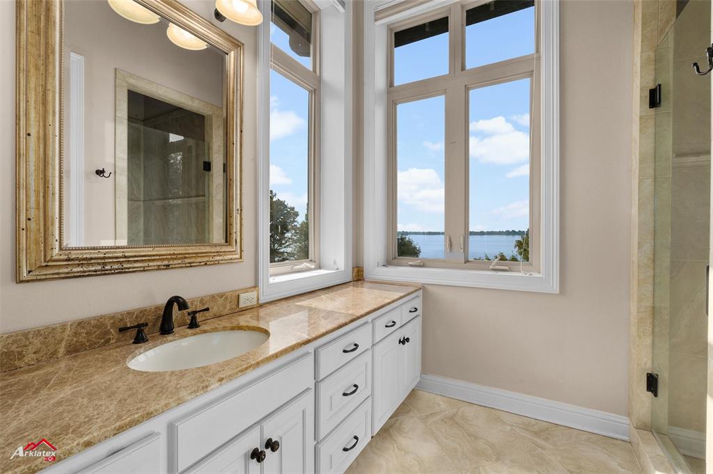 1 Lake Point Place Shreveport, LA 71119 - Photo 27 of 38 a bathroom with a granite countertop sink and a window