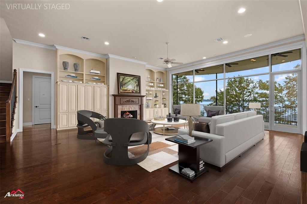1 Lake Point Place Shreveport, LA 71119 - Photo 7 of 38 a living room with fireplace furniture and a large window