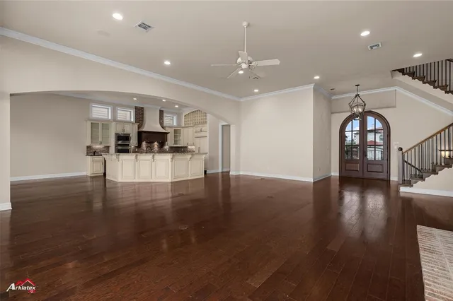 a view of a livingroom with furniture wooden floor and a fireplace