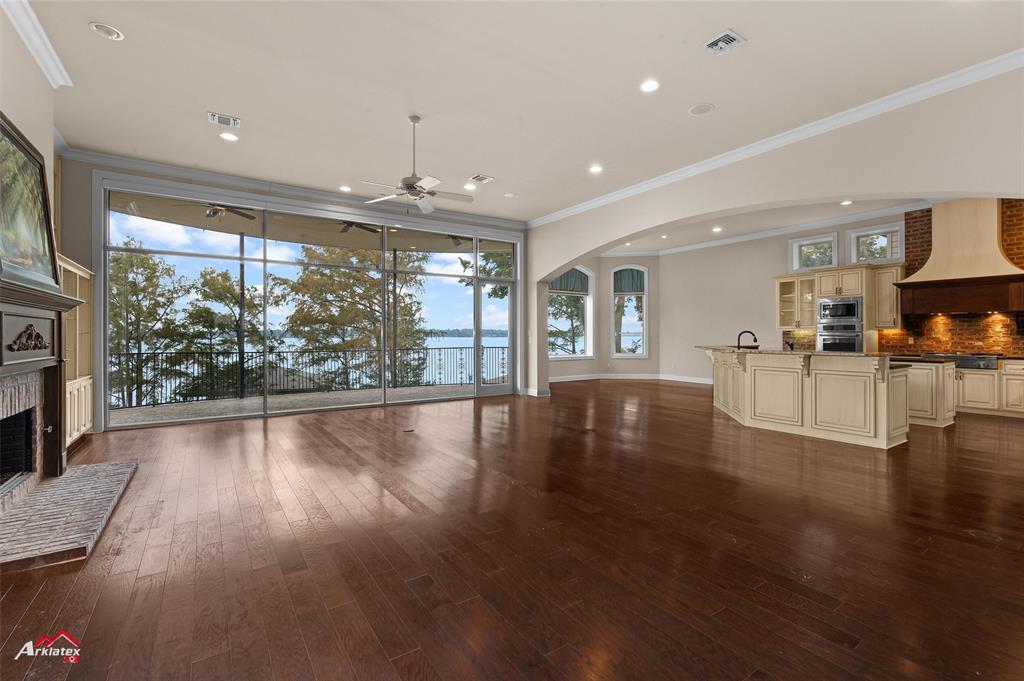 1 Lake Point Place Shreveport, LA 71119 - Photo 10 of 38 a view of a livingroom with furniture wooden floor and a fireplace