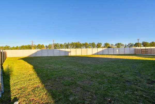 a view of a lake with houses in the back