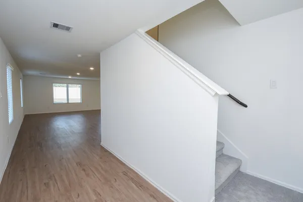 a view of livingroom and hardwood floor