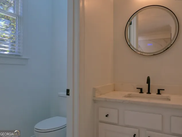 a bathroom with a shower and a sink