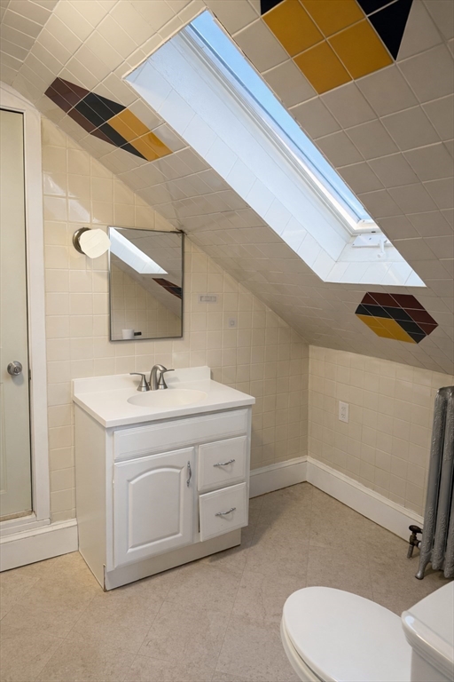 10 Orange Street, Unit 2 Chelsea, MA 02150 - Photo 16 of 17 a bathroom with a sink a toilet and mirror