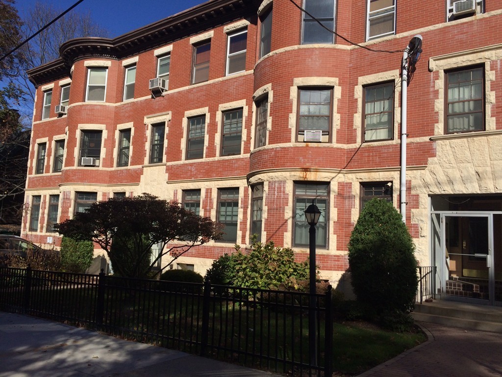 149 Winthrop Road, Unit 1 Brookline, MA 02445 - Photo 1 of 21 a front view of a building with balcony