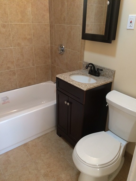 149 Winthrop Road, Unit 1 Brookline, MA 02445 - Photo 8 of 21 a bathroom with a sink and a toilet