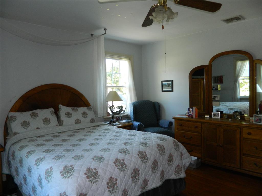 2130 Huntington Street Bethlehem, PA 18017 - Photo 17 of 23 Hardwood floors and a window view elevate this primary bedroom's simple charm.