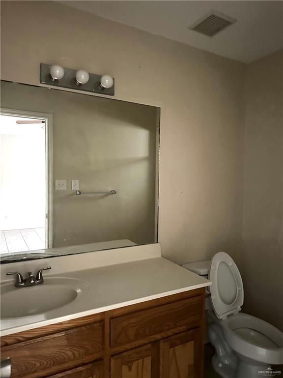 3604 South Wyndham Avenue Pharr, TX 78577 - Photo 8 of 10 a bathroom with a sink and a toilet