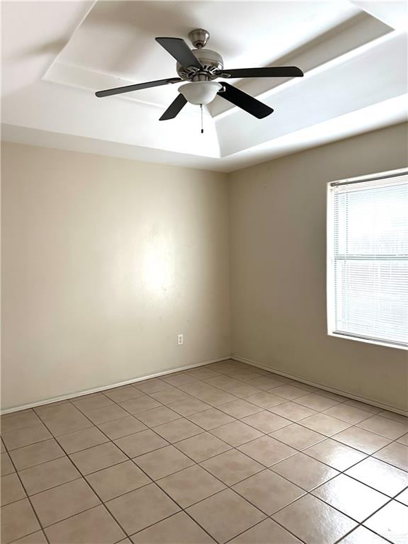 3604 South Wyndham Avenue Pharr, TX 78577 - Photo 9 of 10 an empty room with a ceiling fan and window