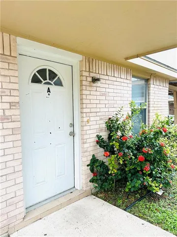 a view of entryway with flower pots
