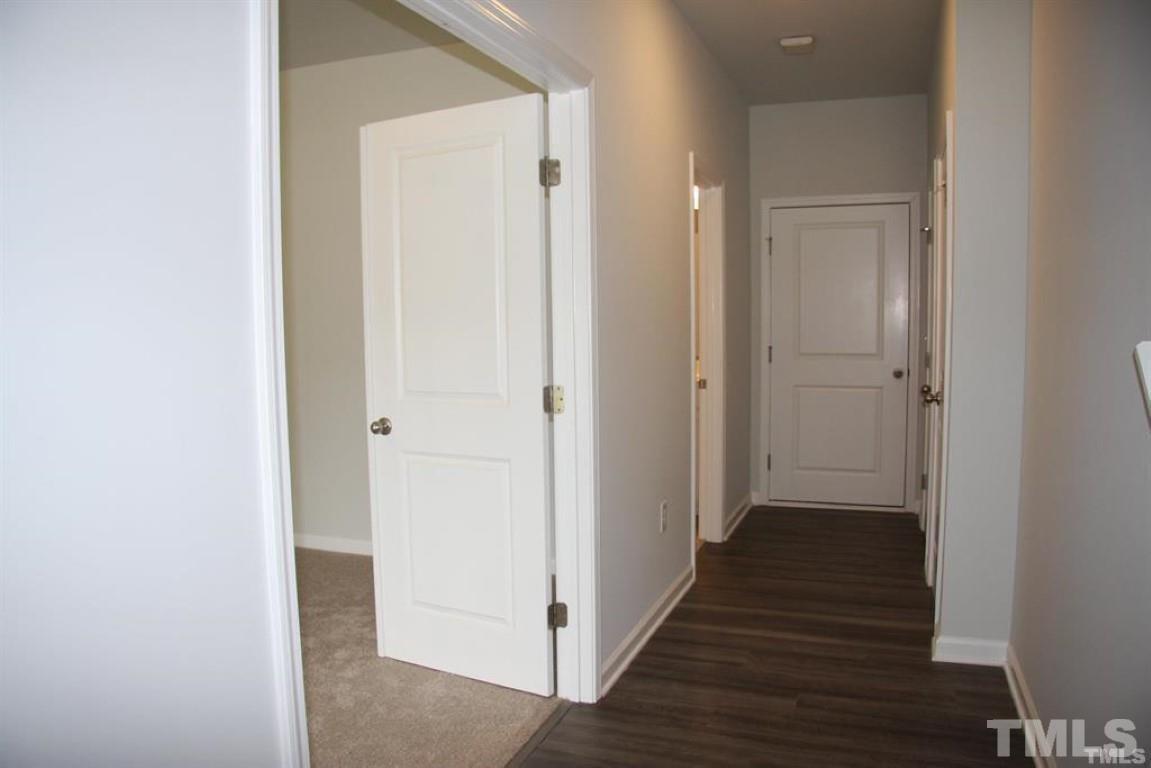 2919 Sunflower Road Apex, NC 27502 - Photo 4 of 34 a view of a hallway with the wooden floor