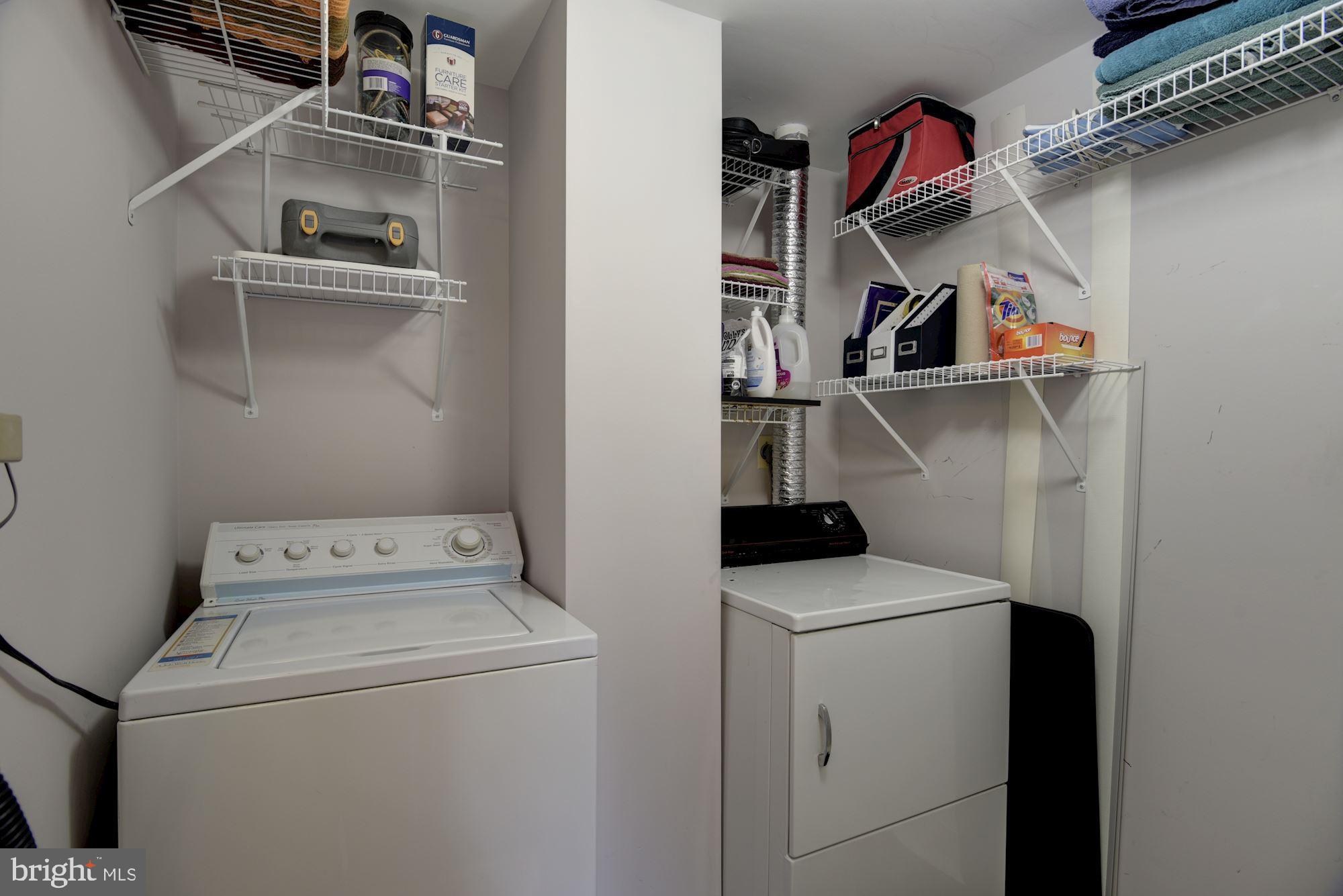 10001 Windstream Drive, Unit 404 Columbia, MD 21044 - Photo 19 of 29 a view of storage and utility room with washer and dryer