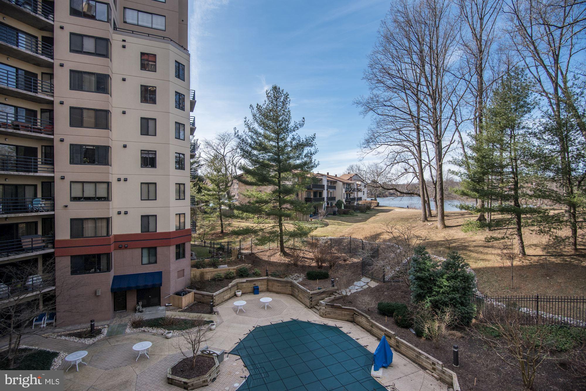10001 Windstream Drive, Unit 404 Columbia, MD 21044 - Photo 24 of 29 a view of a building with a yard