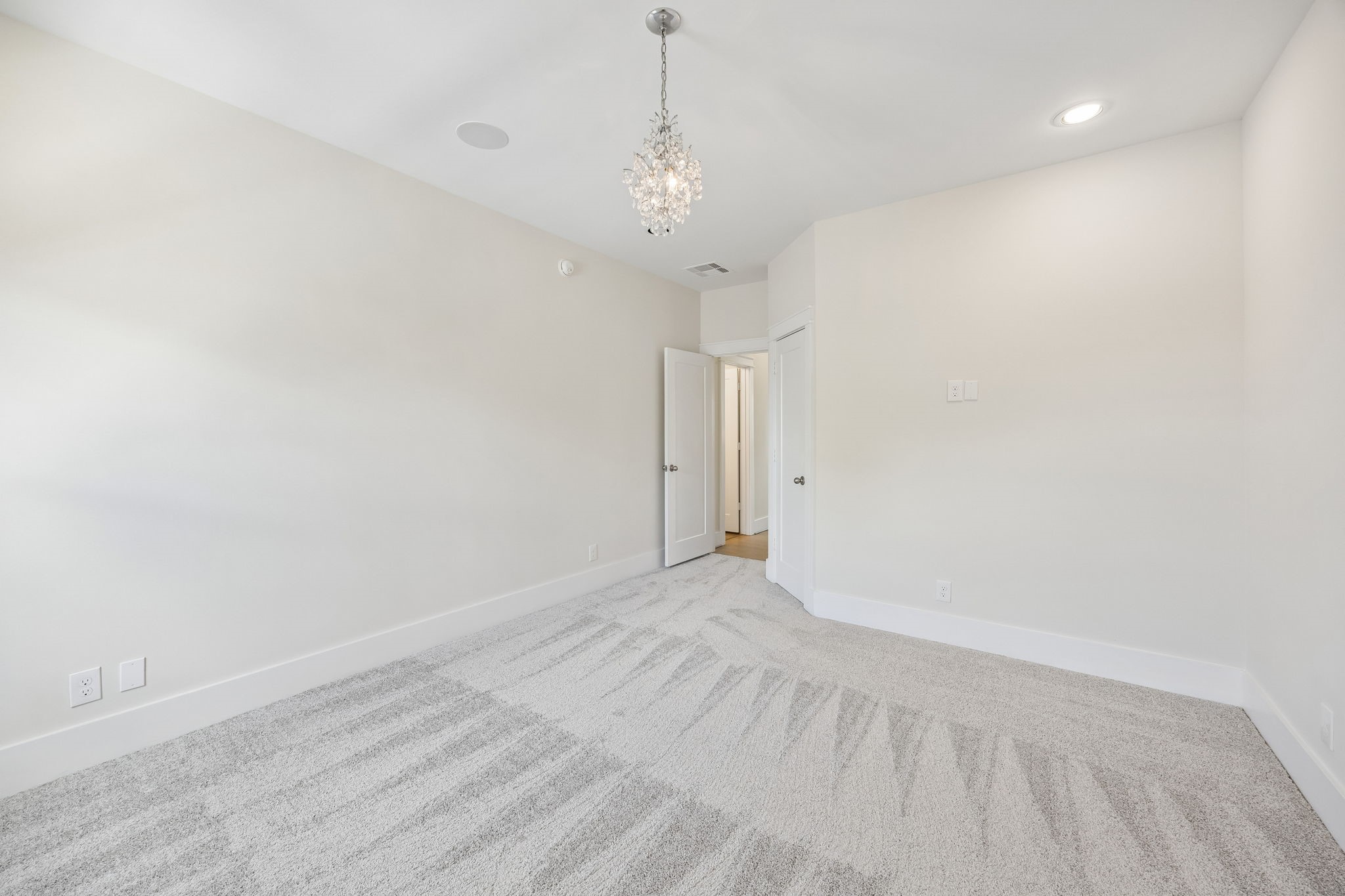 8558 Ridgepoint Drive Houston, TX 77055 - Photo 27 of 39 An alternate angle reveals the room's proportions and flexible furniture placement, with soft carpeting throughout.