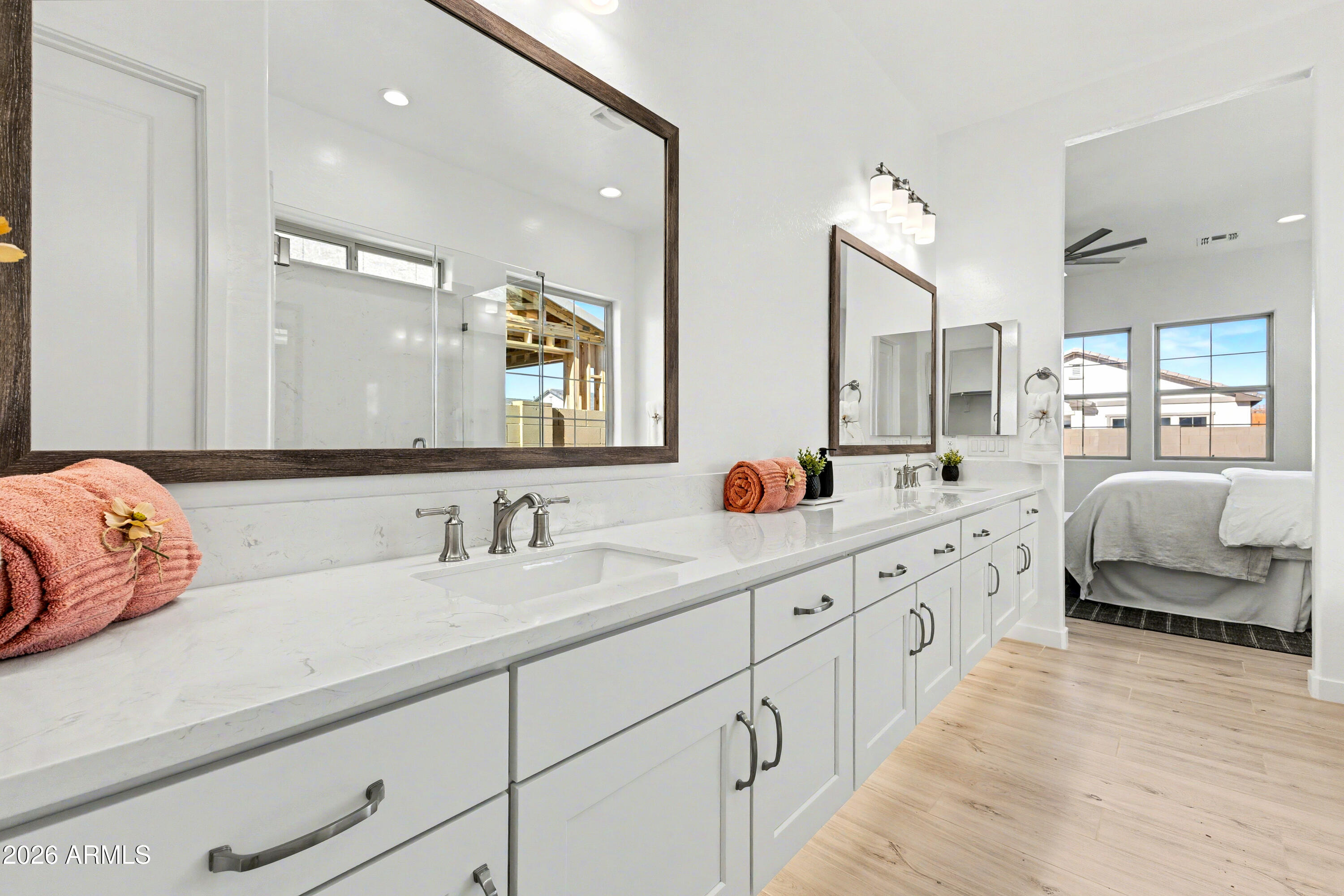 3618 East Roland Street Mesa, AZ 85213 - Photo 11 of 26 a spacious en suite bathroom with double sink and a large mirror