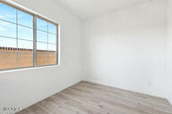 3618 East Roland Street Mesa, AZ 85213 - Photo 17 of 26 an empty room with a window