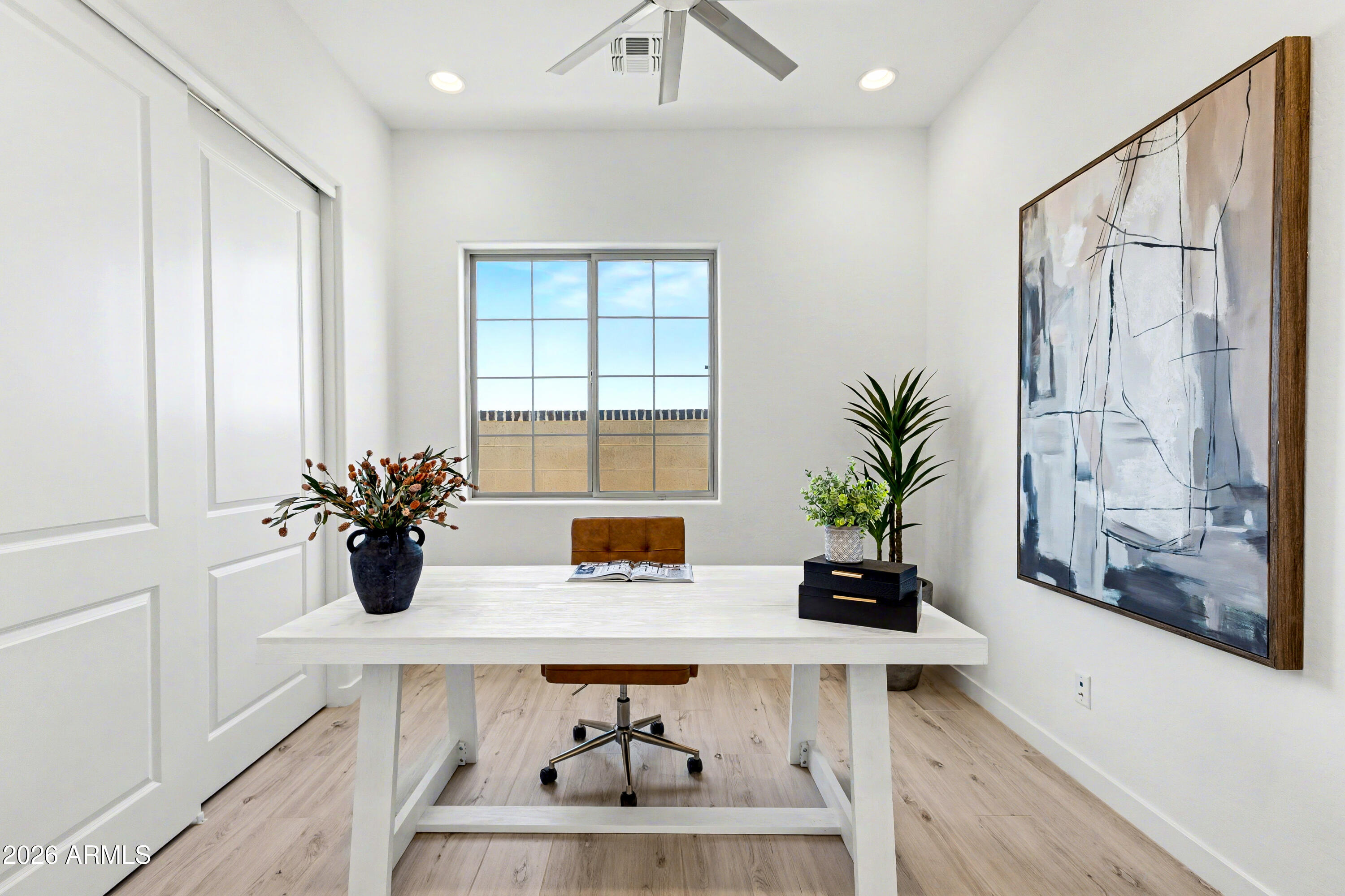 3618 East Roland Street Mesa, AZ 85213 - Photo 19 of 26 a dining room with table & chairs