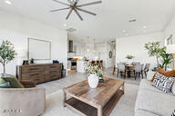 3618 East Roland Street Mesa, AZ 85213 - Photo 2 of 26 a living room with furniture potted plant and a chandelier